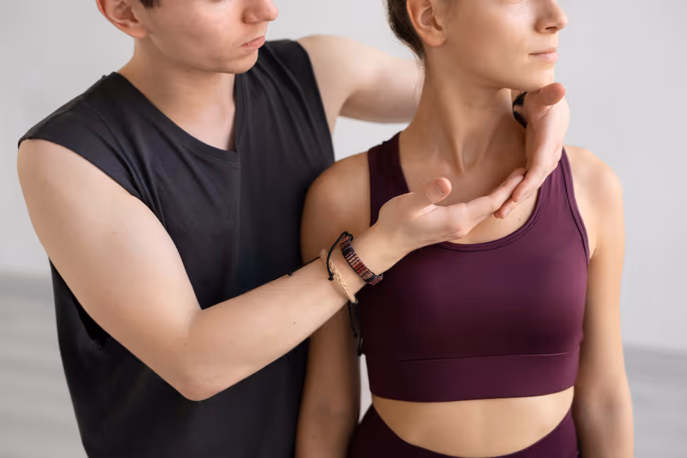 Physiotherapist demonstrating cervical spine assessment and neck mobility exercises for neck pain treatment in Vancouver