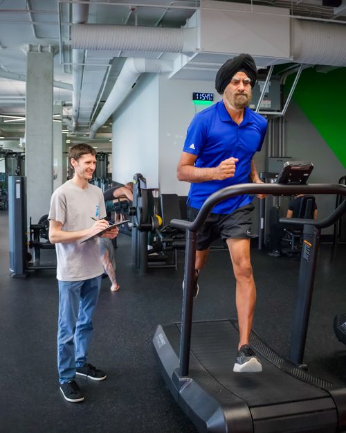 A physiotherapist assessing a patient's gait pattern