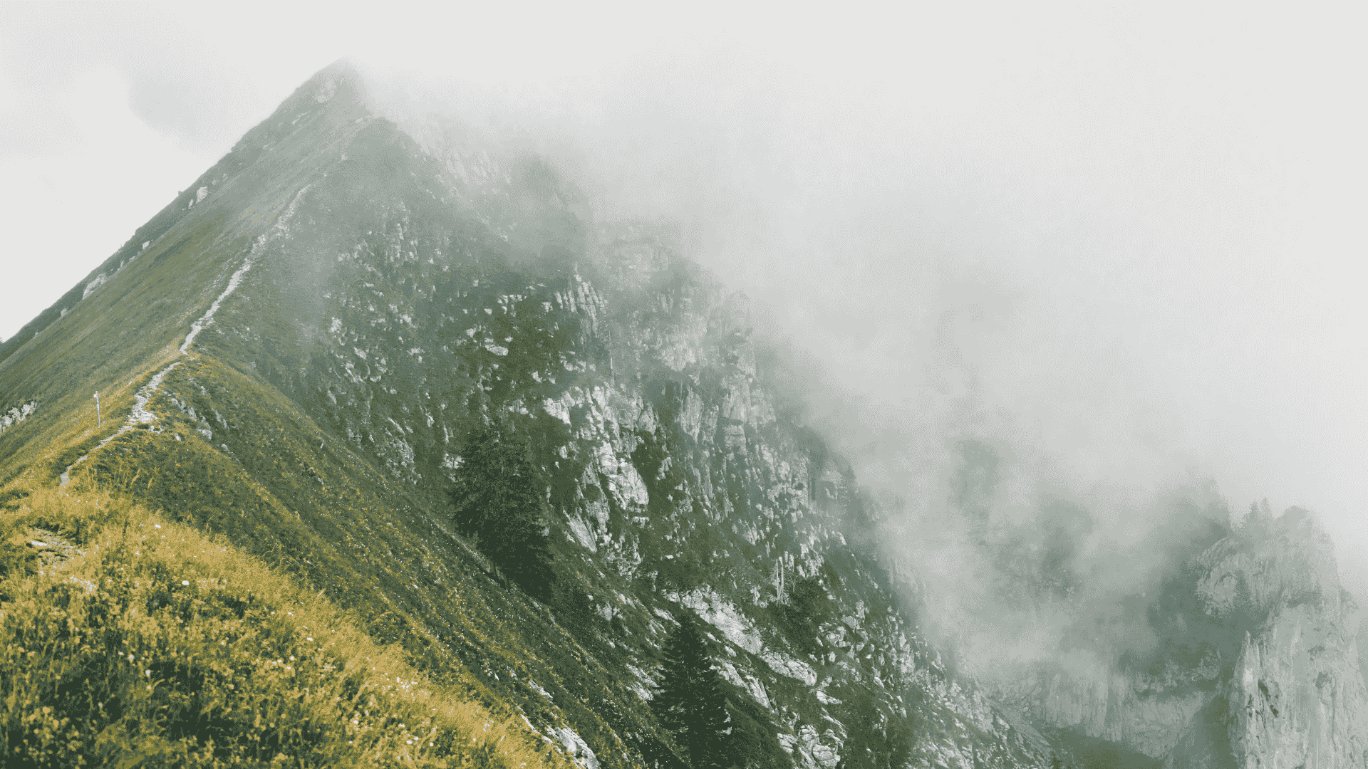 Fog covering mountain ridges in dramatic landscape