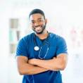 Clinical staff member standing with folded arms, highlighting ACI’s support services for healthcare professionals.