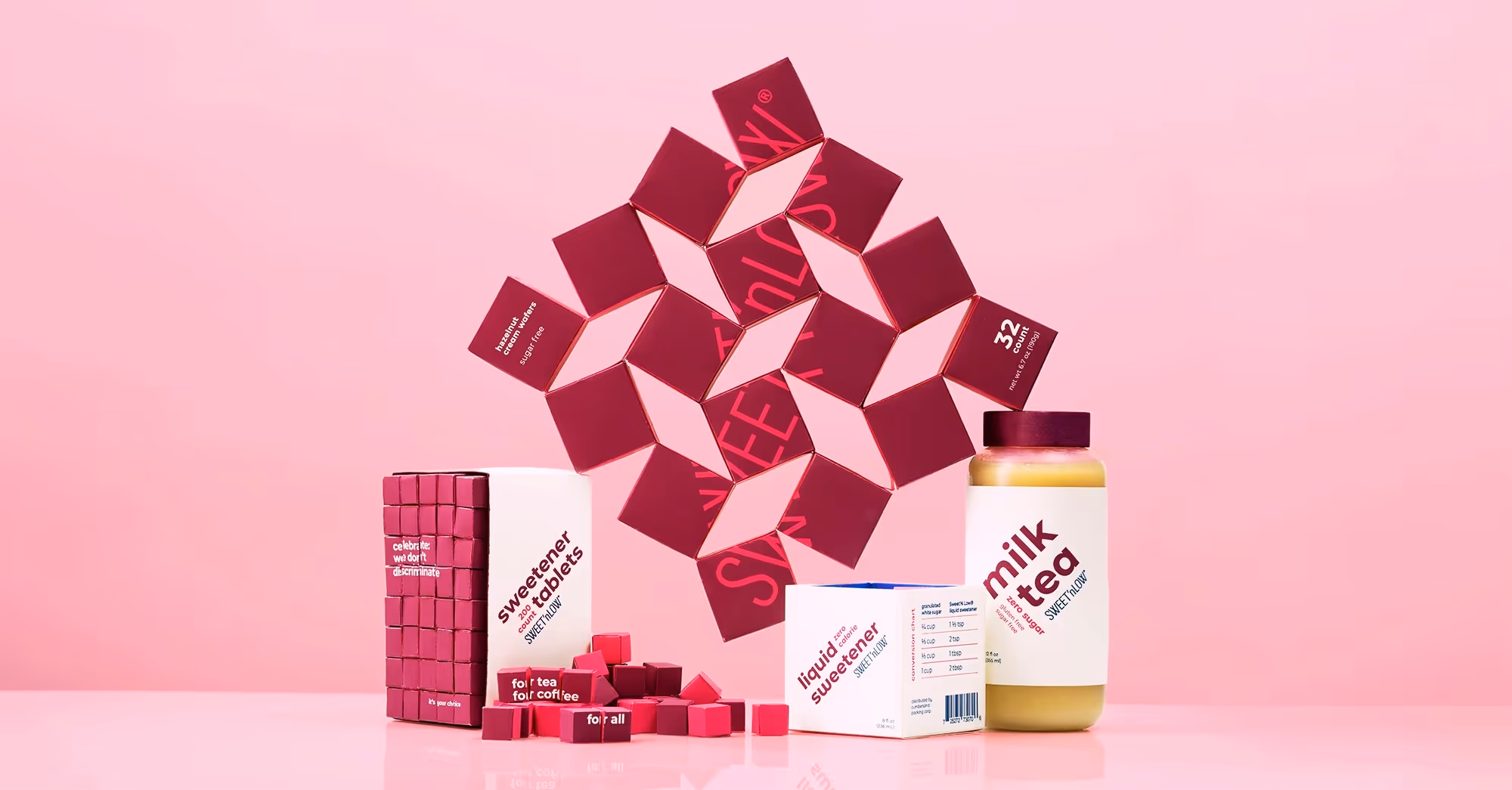 A family photo of the Sweet'N Low family, which is comprised of wafers, tablets, liquid sweetener, and milk tea.