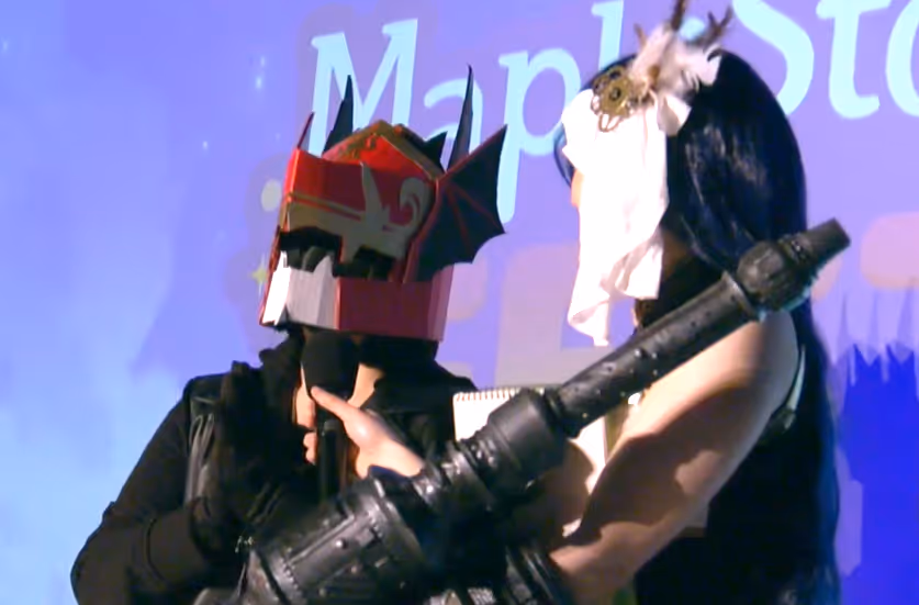 Me at MapleStory Fest with a blaster cosplayer.