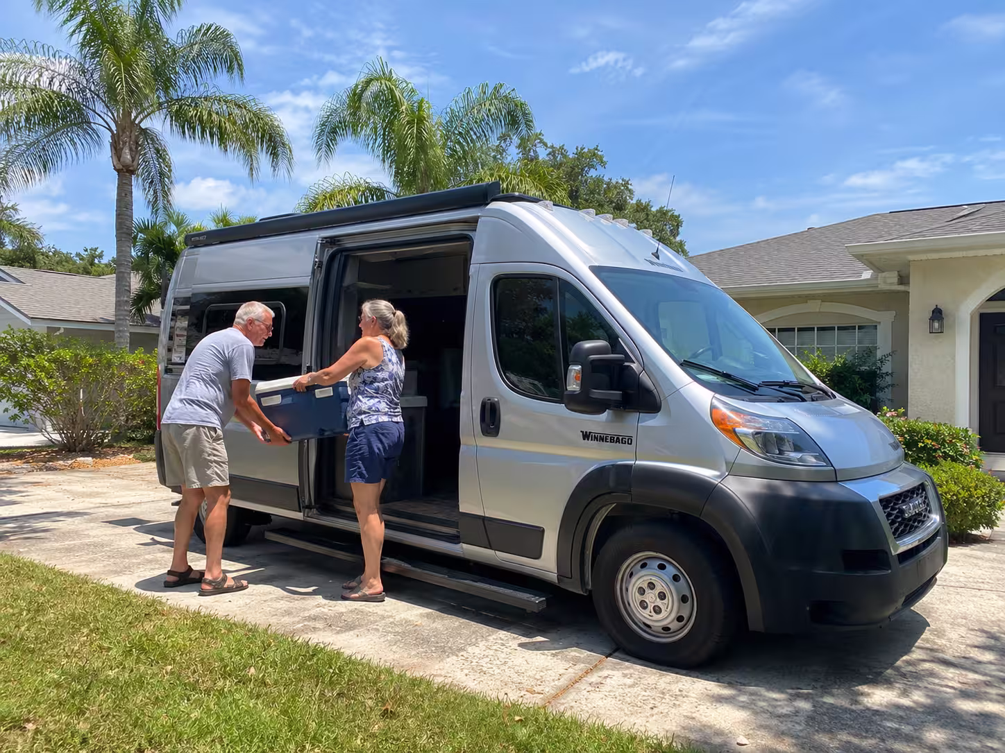 Small RV rental parked in a Brooksville driveway