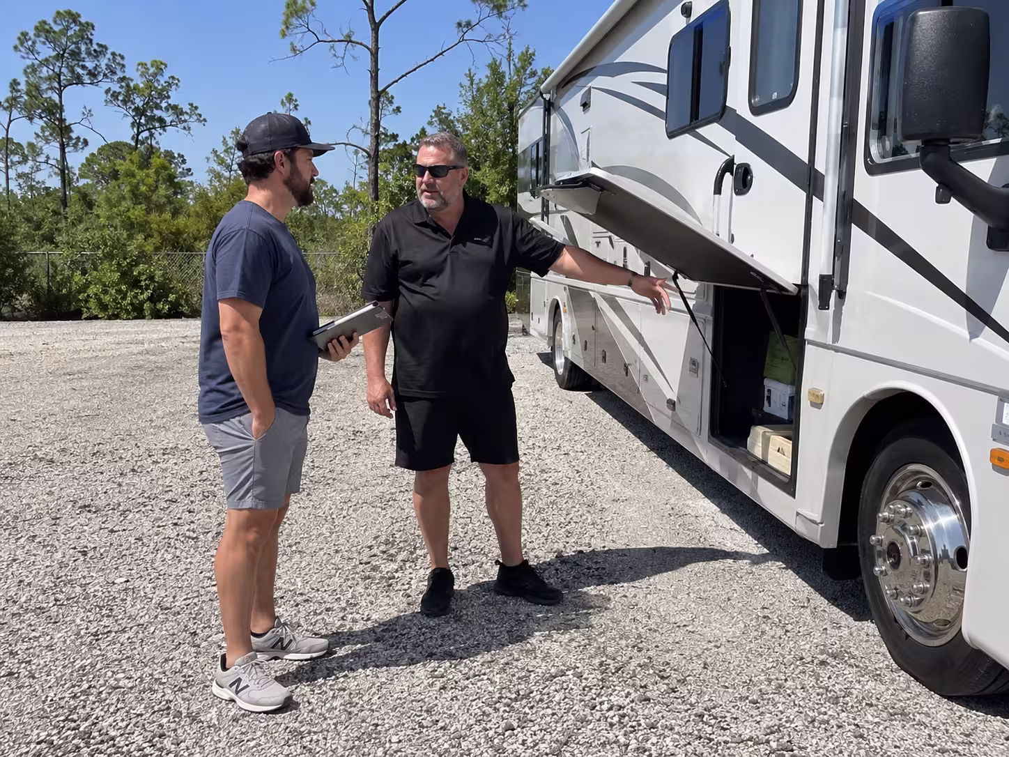 Manager reviewing motorhome rental details, Brooksville FL