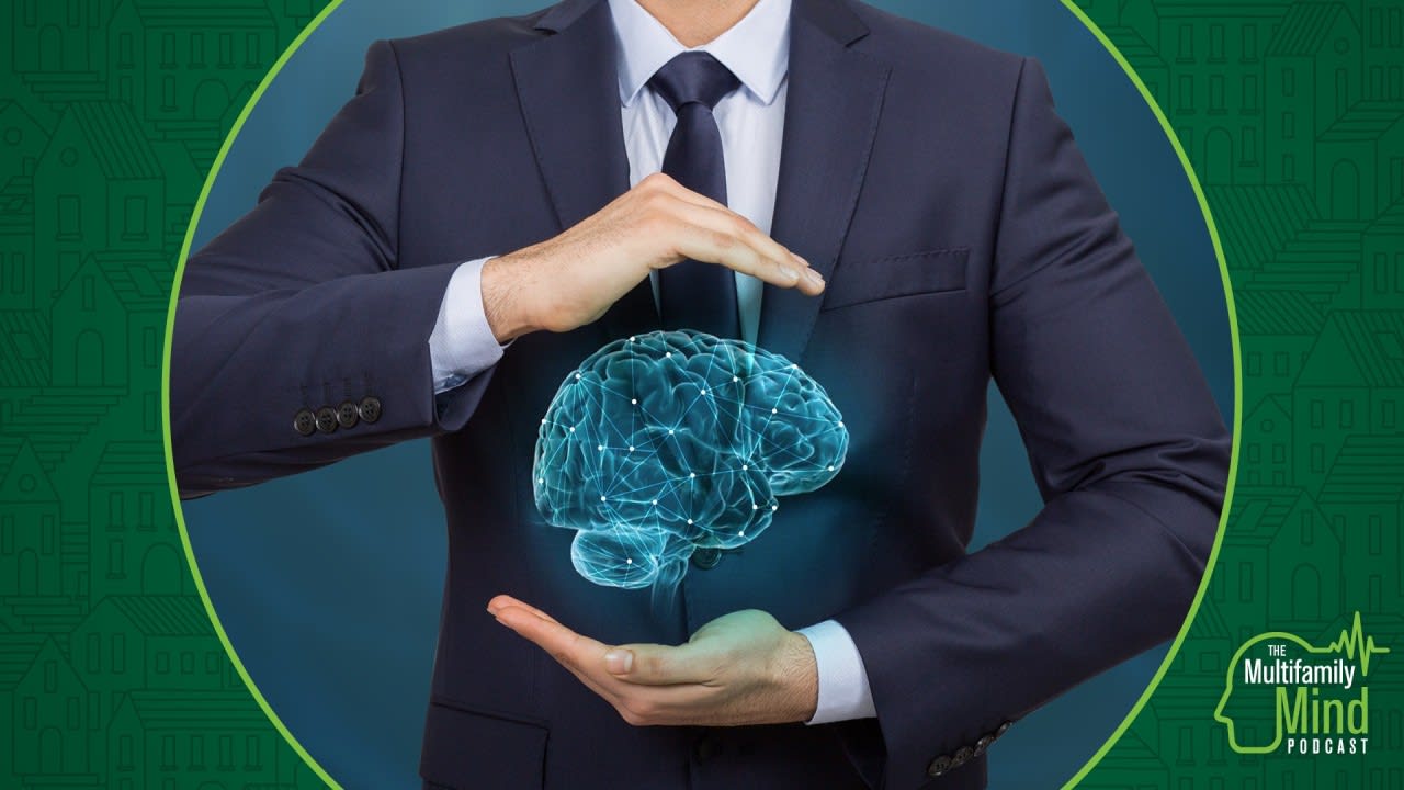 holographic brain between man in suits hands