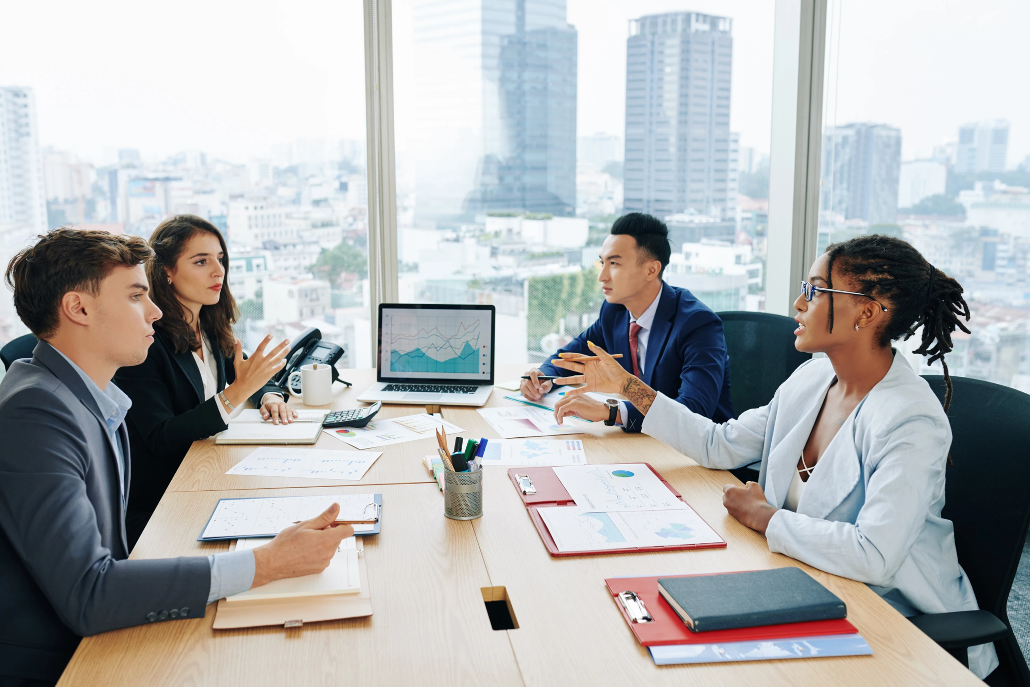 people working at a table in city office