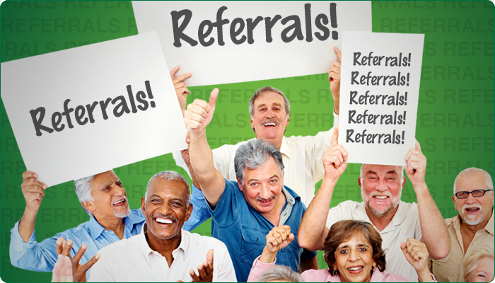 group of older people holding signs that say referrals