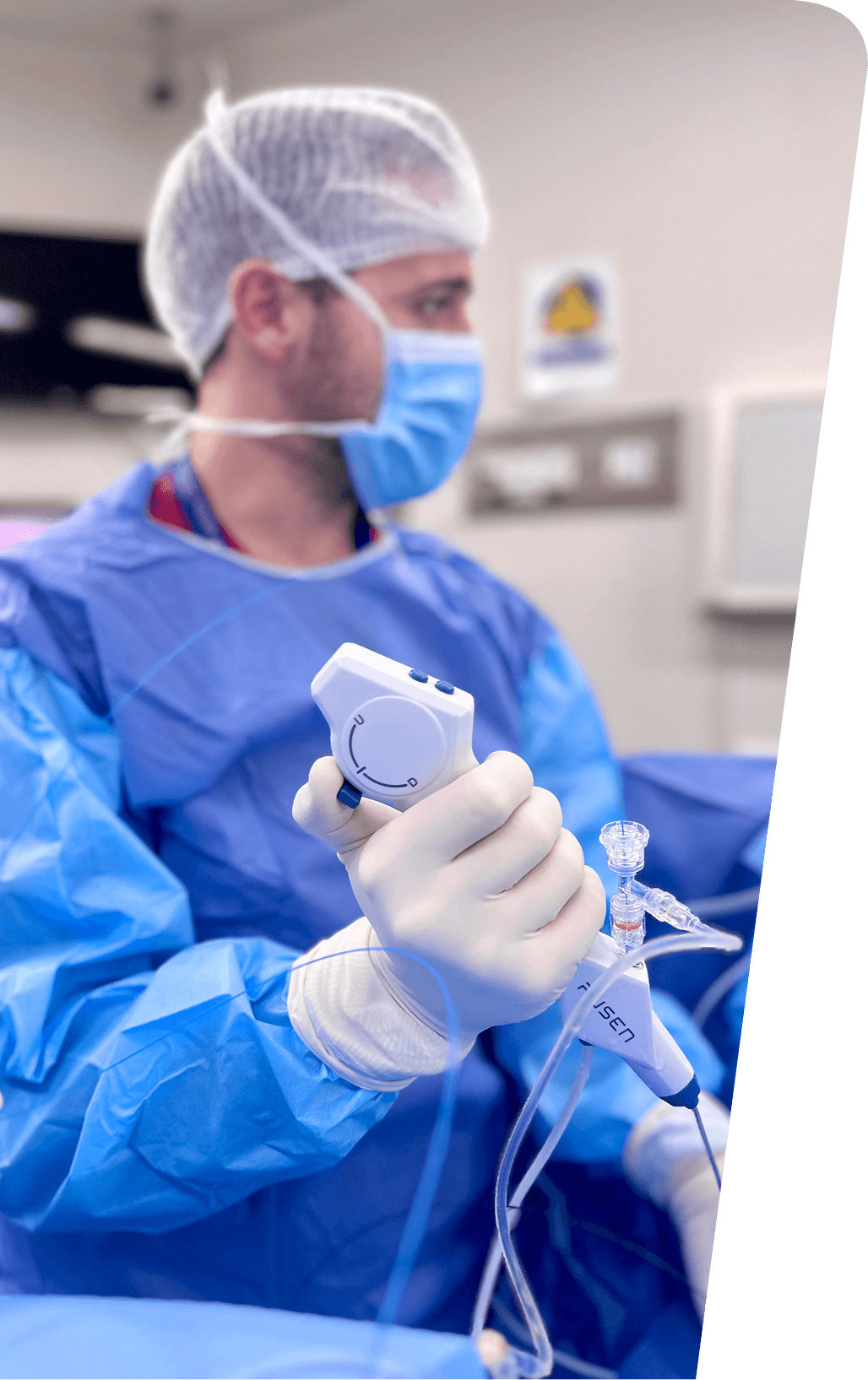 Surgeons wearing masks and sterile gowns performing a surgical procedure in an operating room.