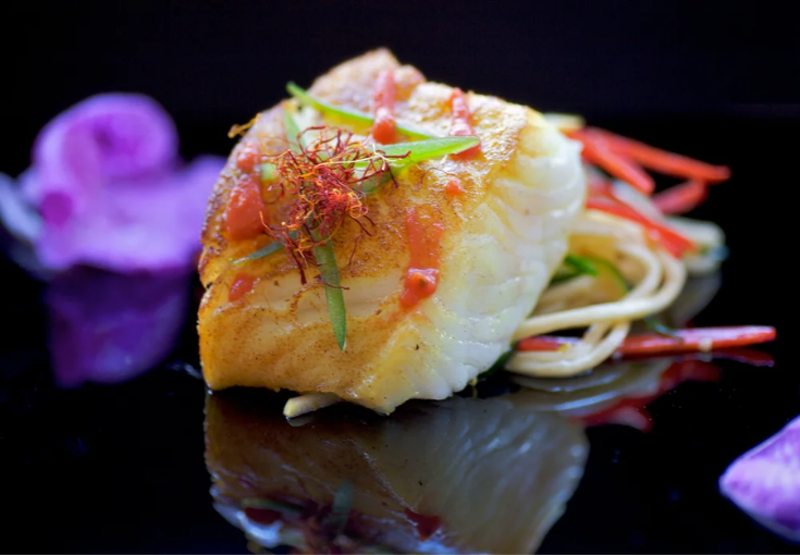 The Raging Skillet chef searing scallops