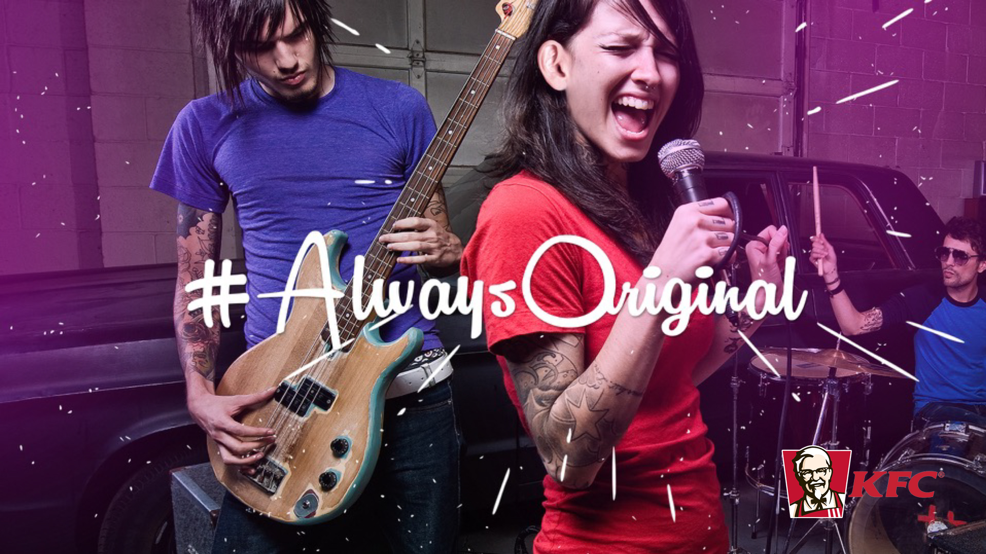 Tattooed young woman singing into a microphone and a man playing guitar with a drummer in background, overlay text #AlwaysOriginal and KFC logo.