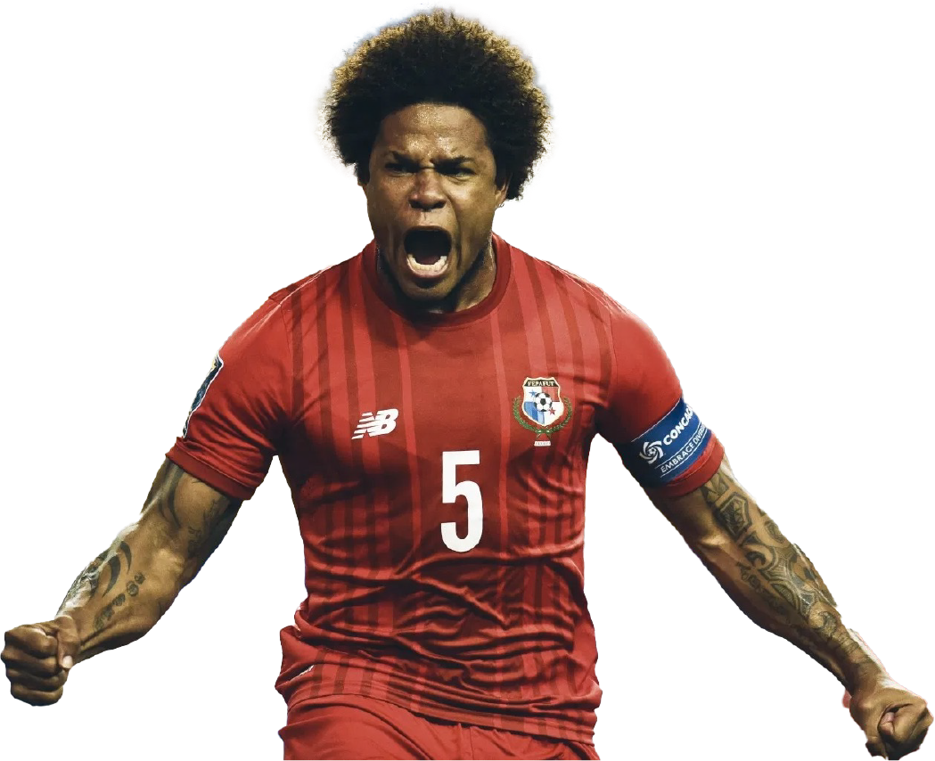 Soccer player with afro hairstyle wearing a red Panama football jersey, shouting with fists clenched.