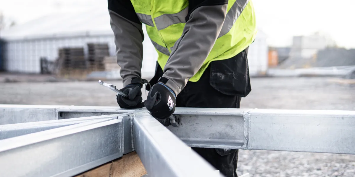 Worker tightening bolts