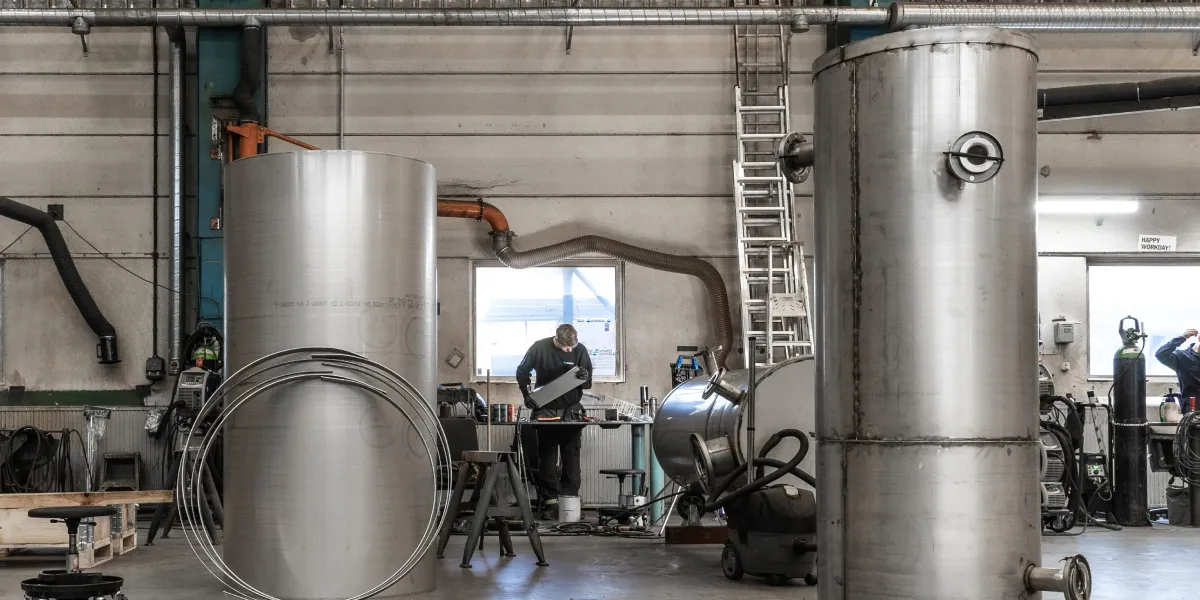 Welder working on tube system