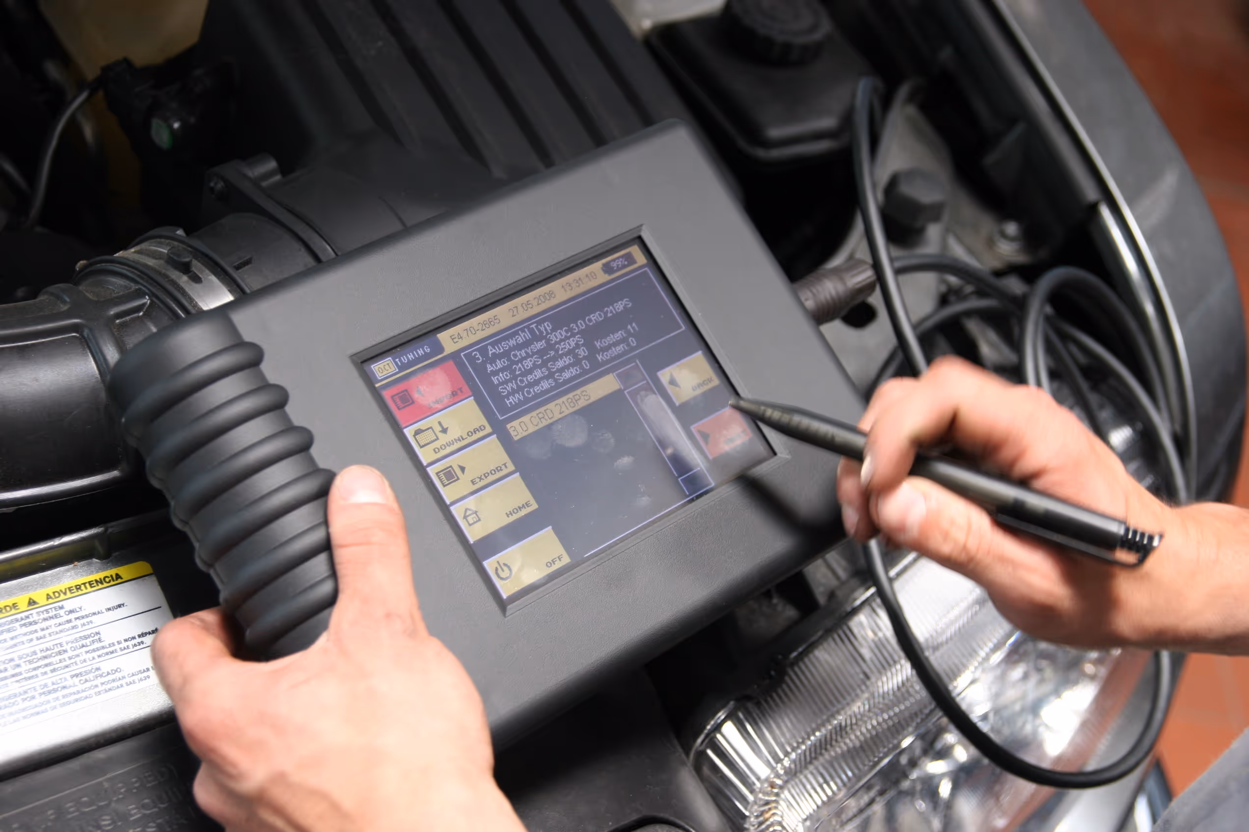 Mobile mechanic carrying out car diagnostics at home using professional diagnostic equipment in Berkshire