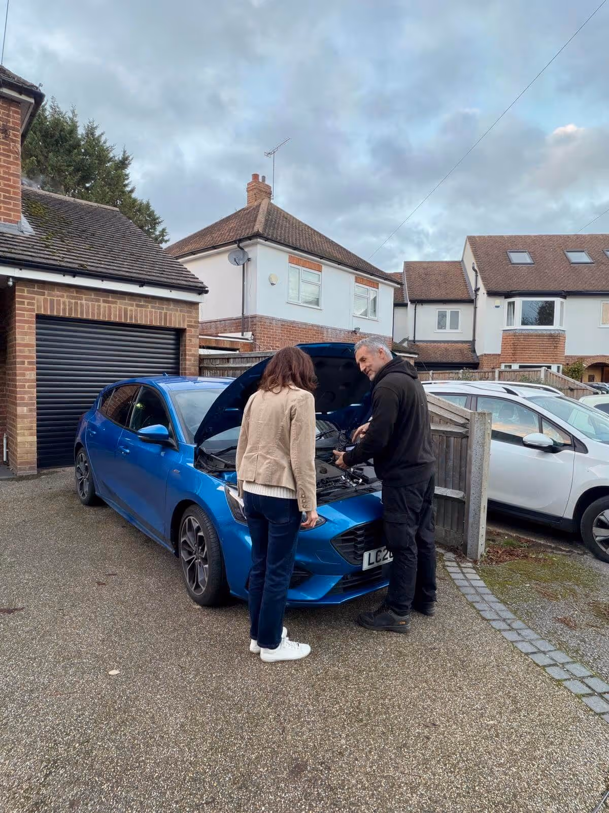 Mobile mechanic carrying out a full vehicle diagnostics check at a customer’s home in Wokingham