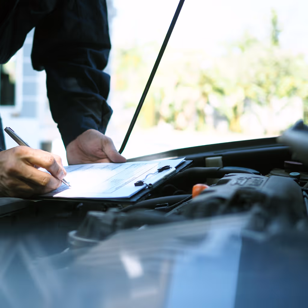 Finalizing the 136-point Standard inspection report on-site. Graeme (35+ years in auto trade) documents mechanical and electrical systems for buyers in Marlow.