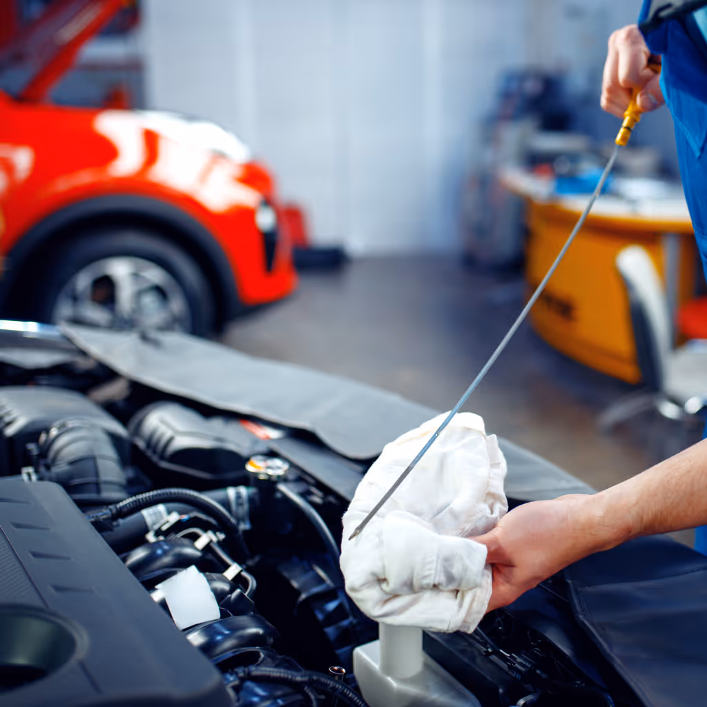 A Maxamy Mobile Autocare technician verifying engine oil levels during a mobile safety inspection in Buckinghamshire. Proper lubrication checks are a key part of our £64.99 fixed-price service.