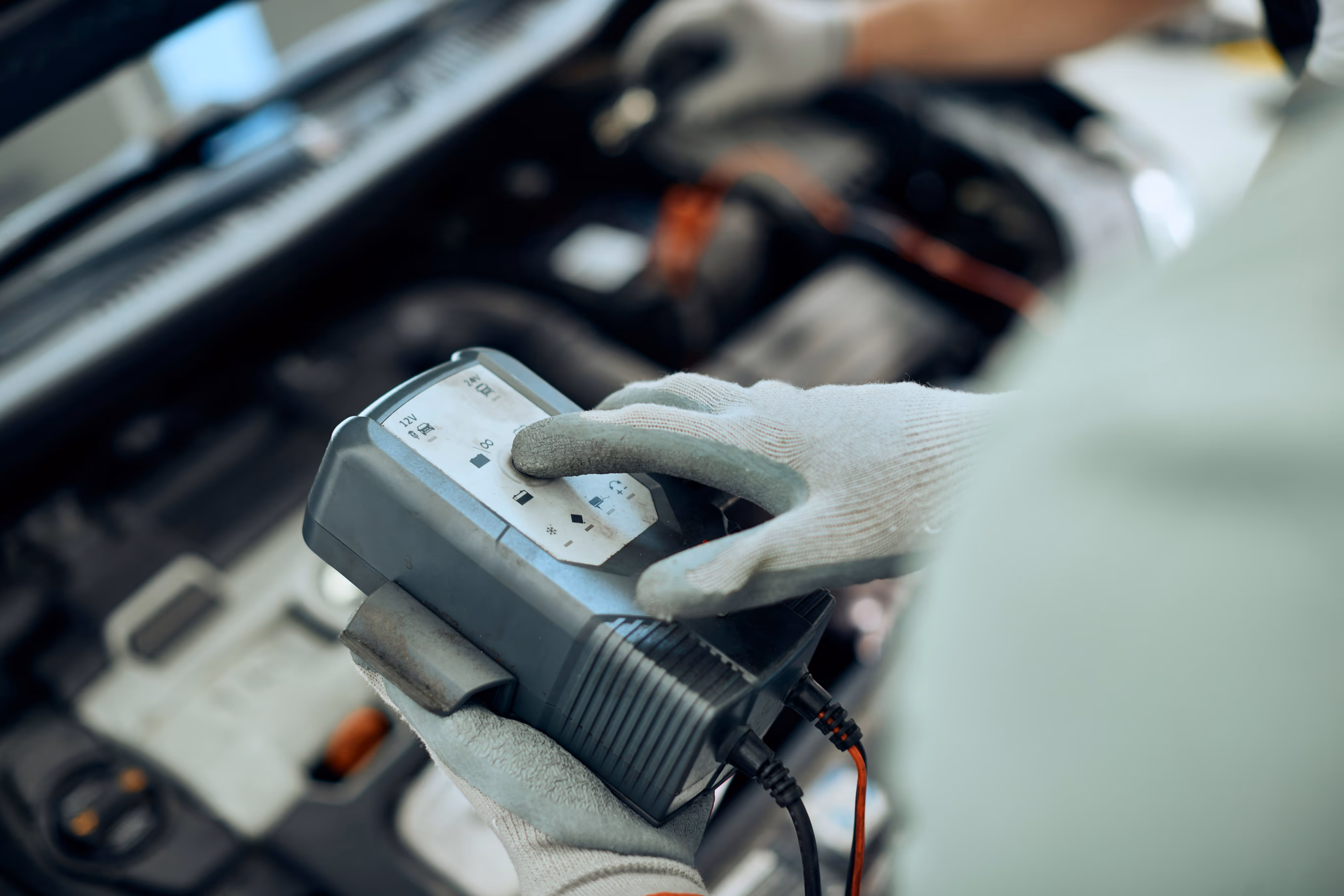 Mobile mechanic using diagnostic equipment as part of a thorough pre-purchase vehicle inspection in Berkshire