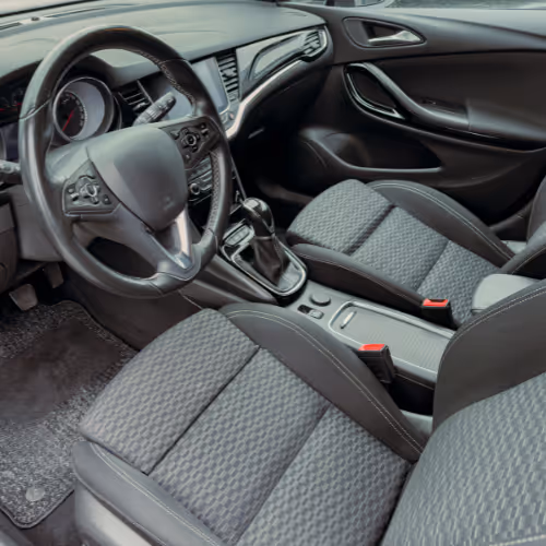 Car interior showing the front seats and dashboard during an interior inspection as part of a vehicle health check.