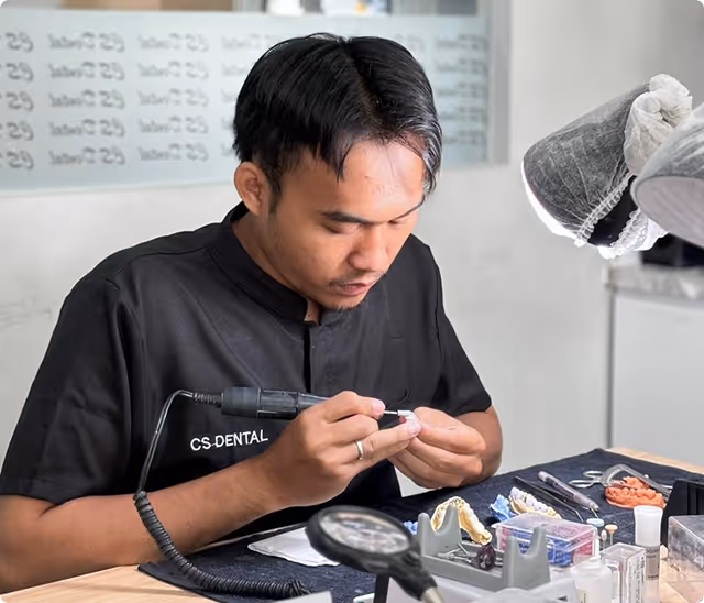 Dental technician working in clinic’s lab