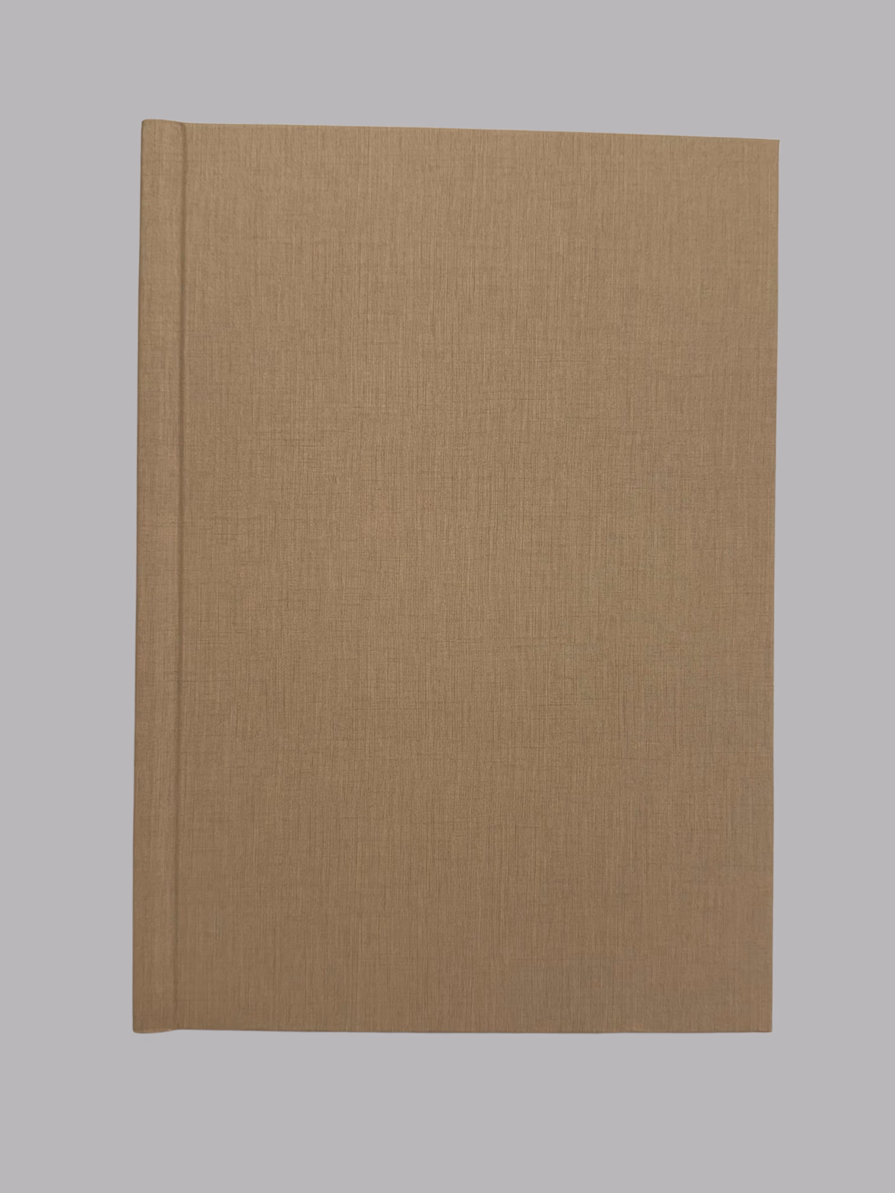 Closed hardcover book with plain brown textured cover on a gray background.