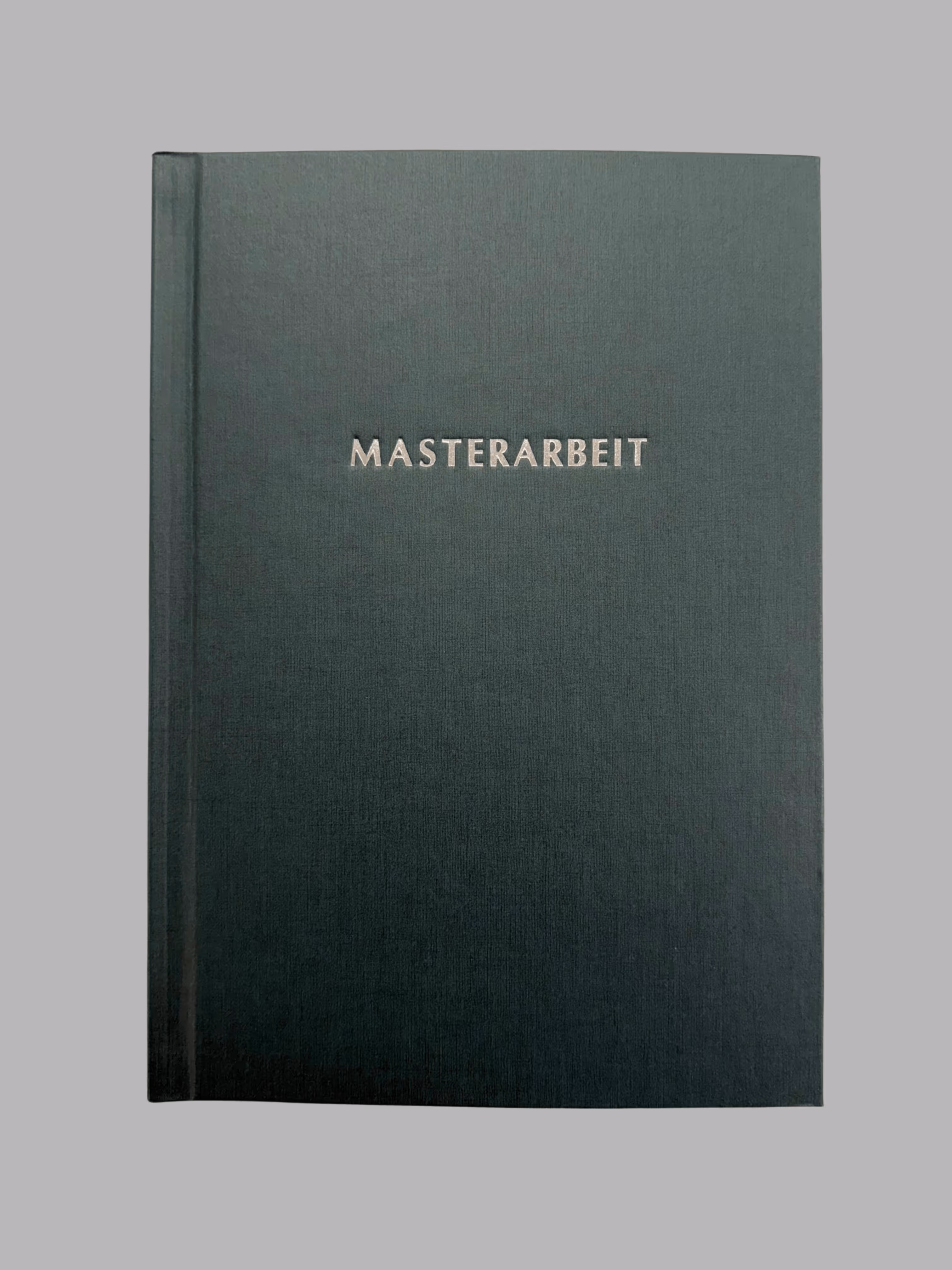Dark green hardcover book with the word 'MASTERARBEIT' embossed in gold on the front cover.