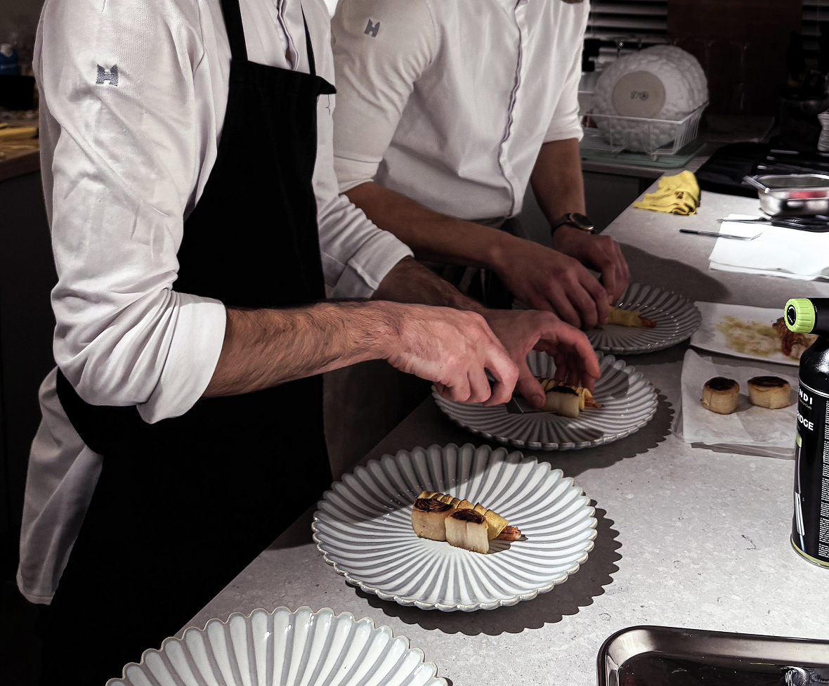 Chef hands plating food