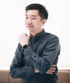 William Tanuwijaya, smiling and posing