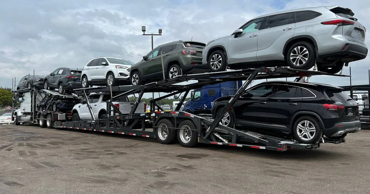 A car hauling truck loaded with cars.