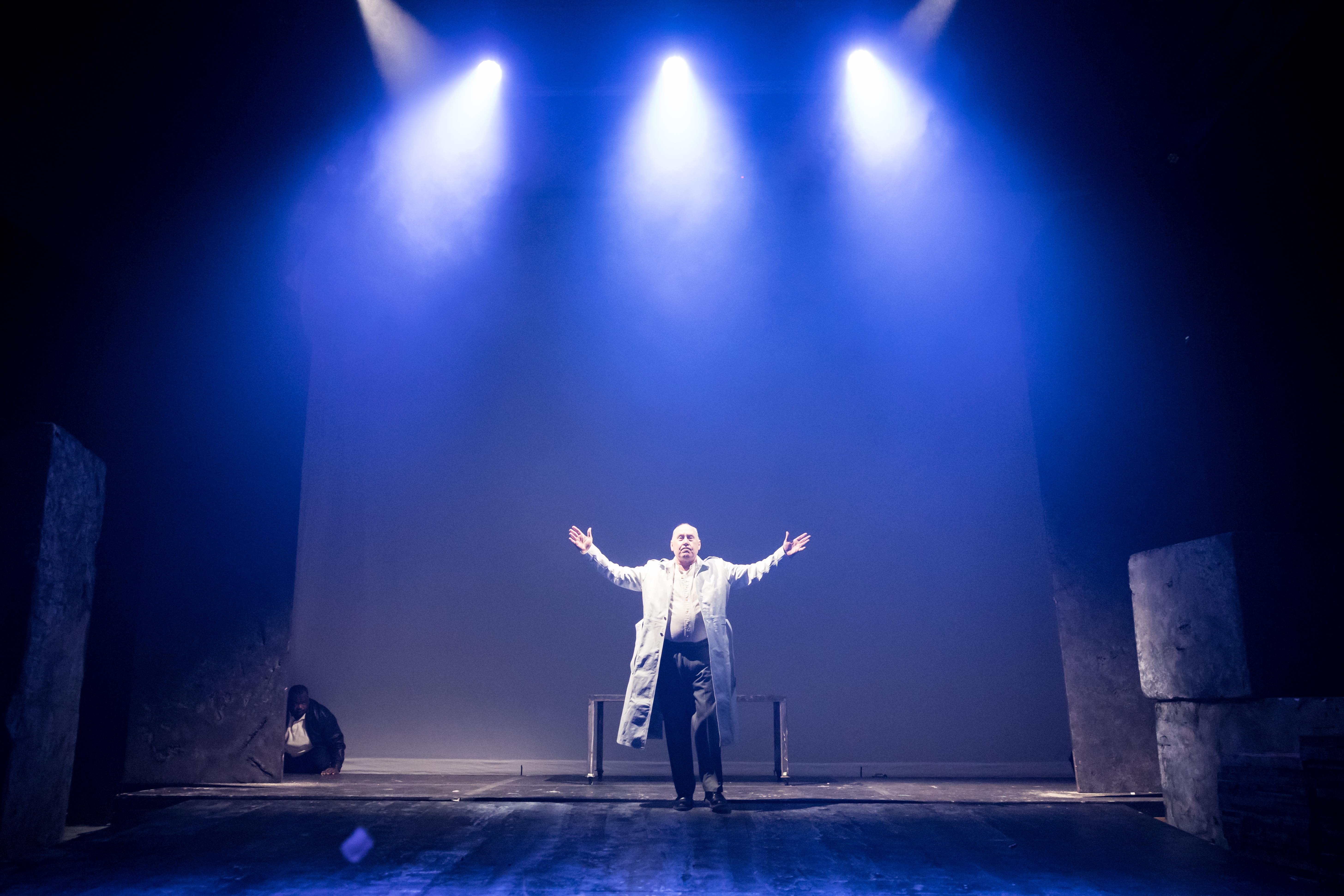 A performer with arms outstretched in MST's 2026 production of Julius Caesar.