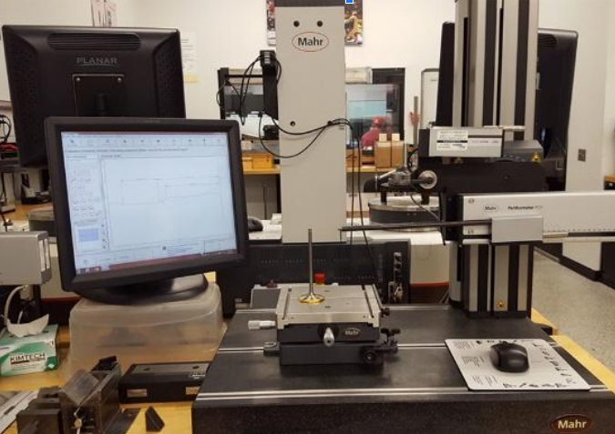 Mahr precision metrology station performing dimensional inspection in the JGA Quality Lab, ensuring strict adherence to AS9100 aerospace standards.