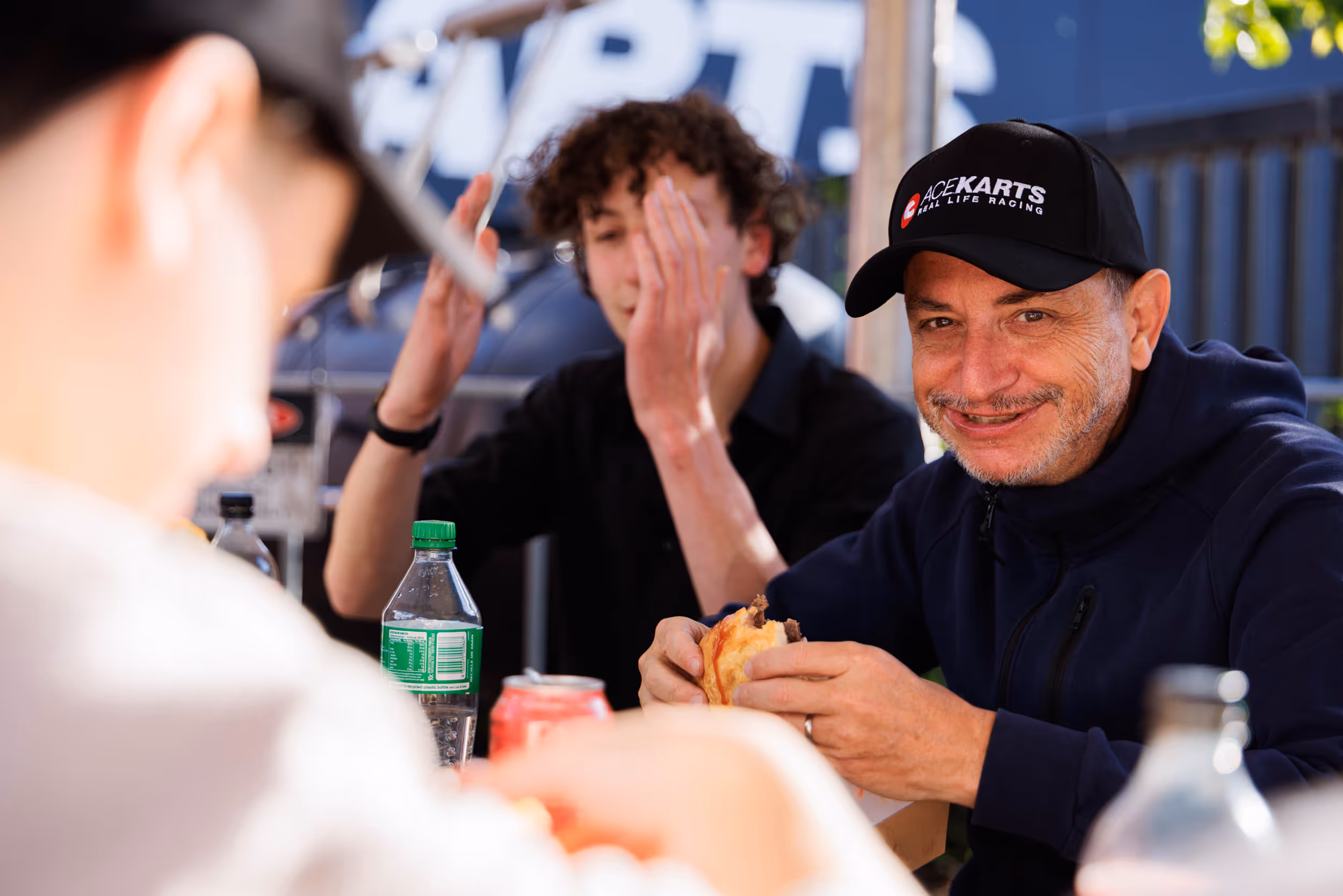 Group enjoying BBQ food at a table