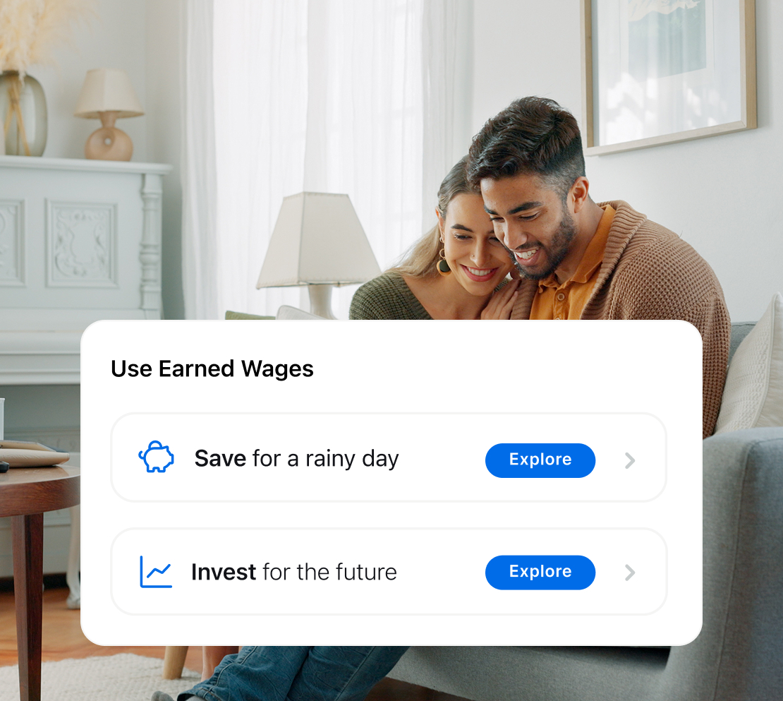 Smiling couple sitting on a couch with a pop-up message about using earned wages to save for a rainy day or invest for the future, each option with an Explore button.