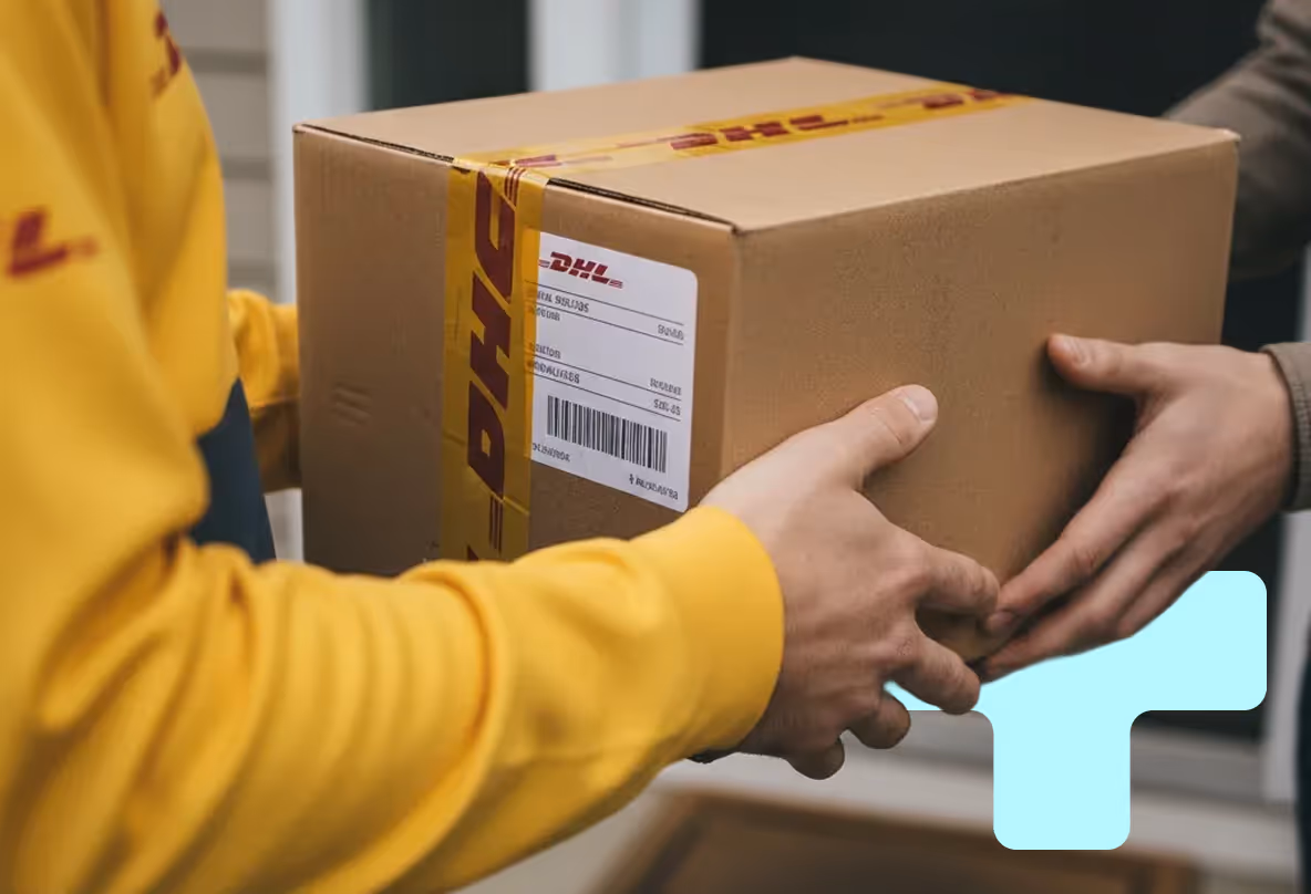 Man holding a microphone and speaking next to a screen displaying a presentation with a photo of Boris Bösch and the title 'One Brand, Multiple' in a setting with plants.