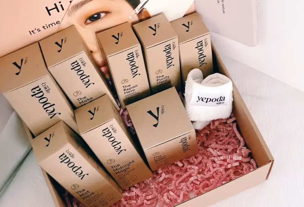 Man holding a microphone speaking next to a screen displaying a presentation slide with a photo of Boris Bosch and the title 'One Brand, Multiple'.