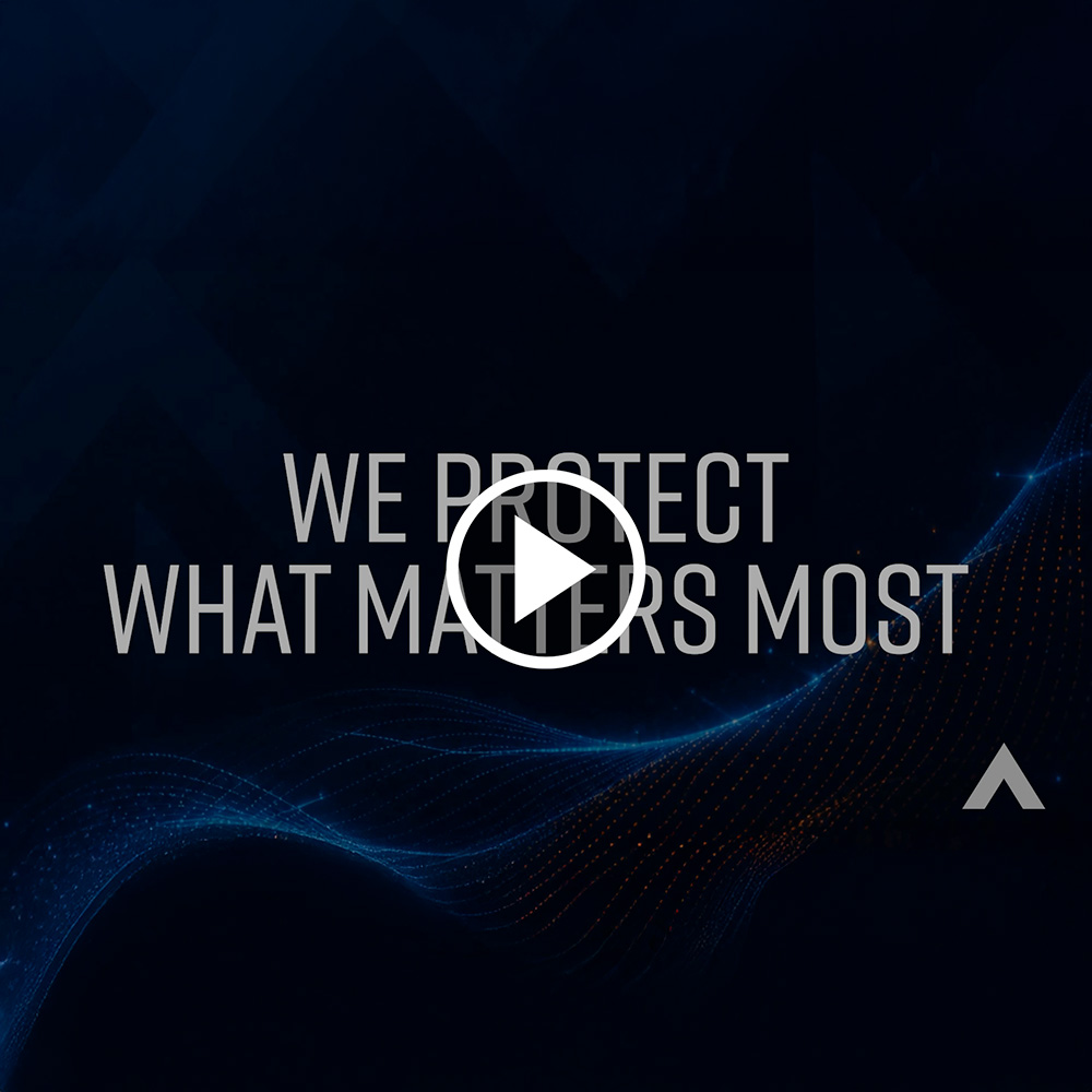 Dark background with blue wave lines and text 'We Protect What Matters Most' with a play button overlay.