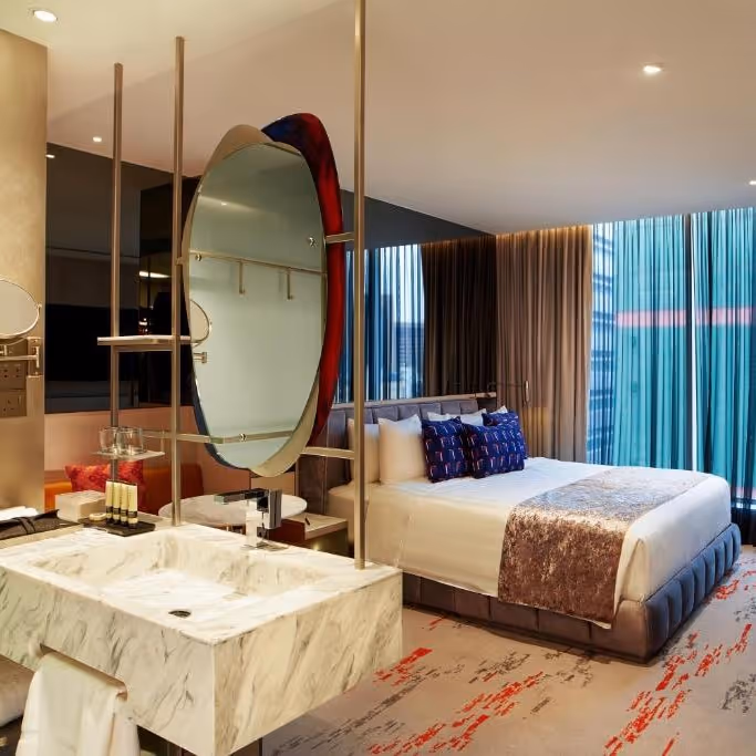 big bedroom with double bed and on suite bathroom