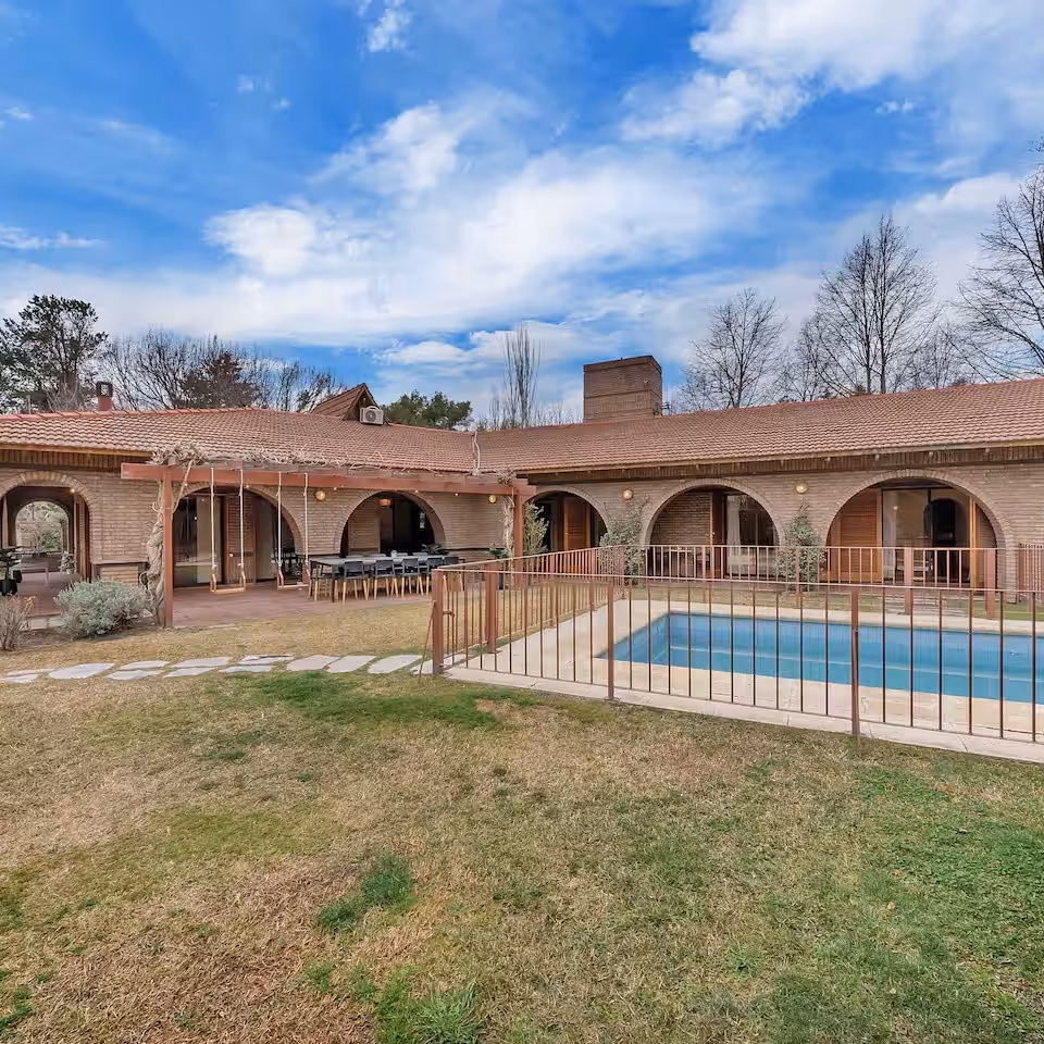 a pool next to small hotel