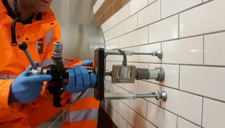 Adhesion pull off testing of decorative tile.