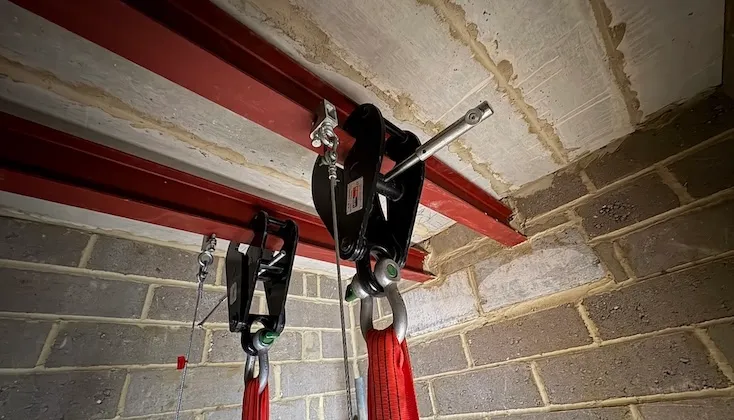 Two beams simultaneously load tested at midspan.