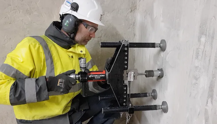 Concrete adhesion pull off load testing.
