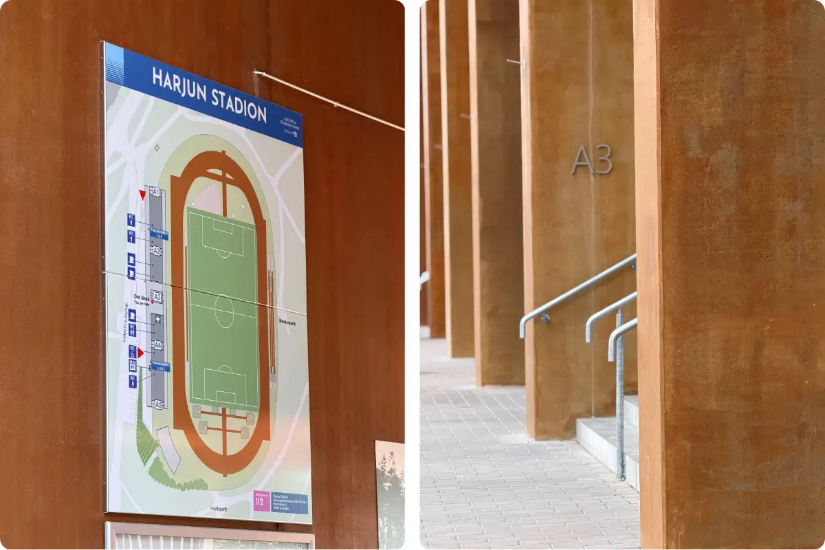 Harjun stadionin katsomon edustaa ja stadionin opastetaulu