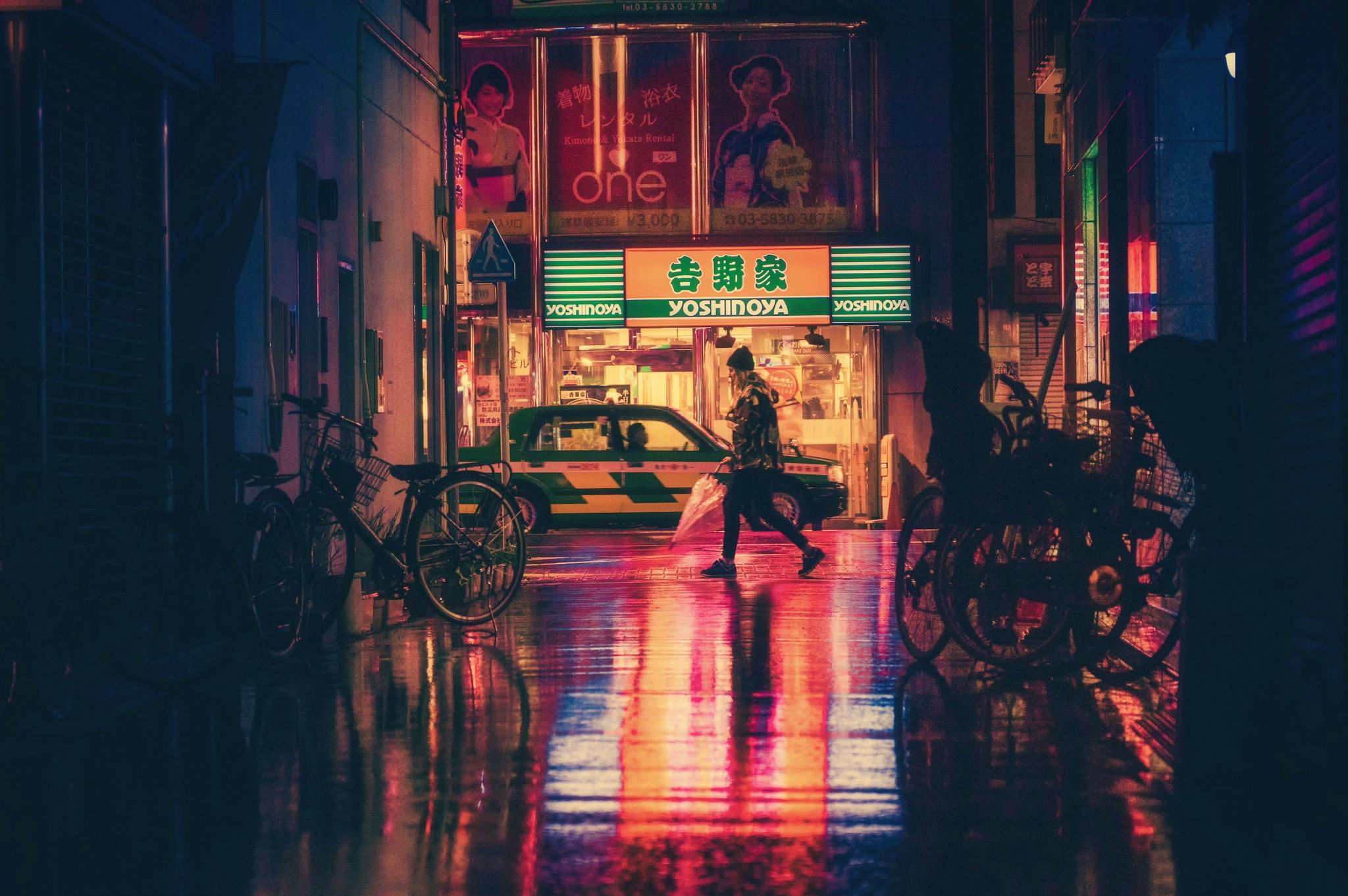Person walking at night in the city