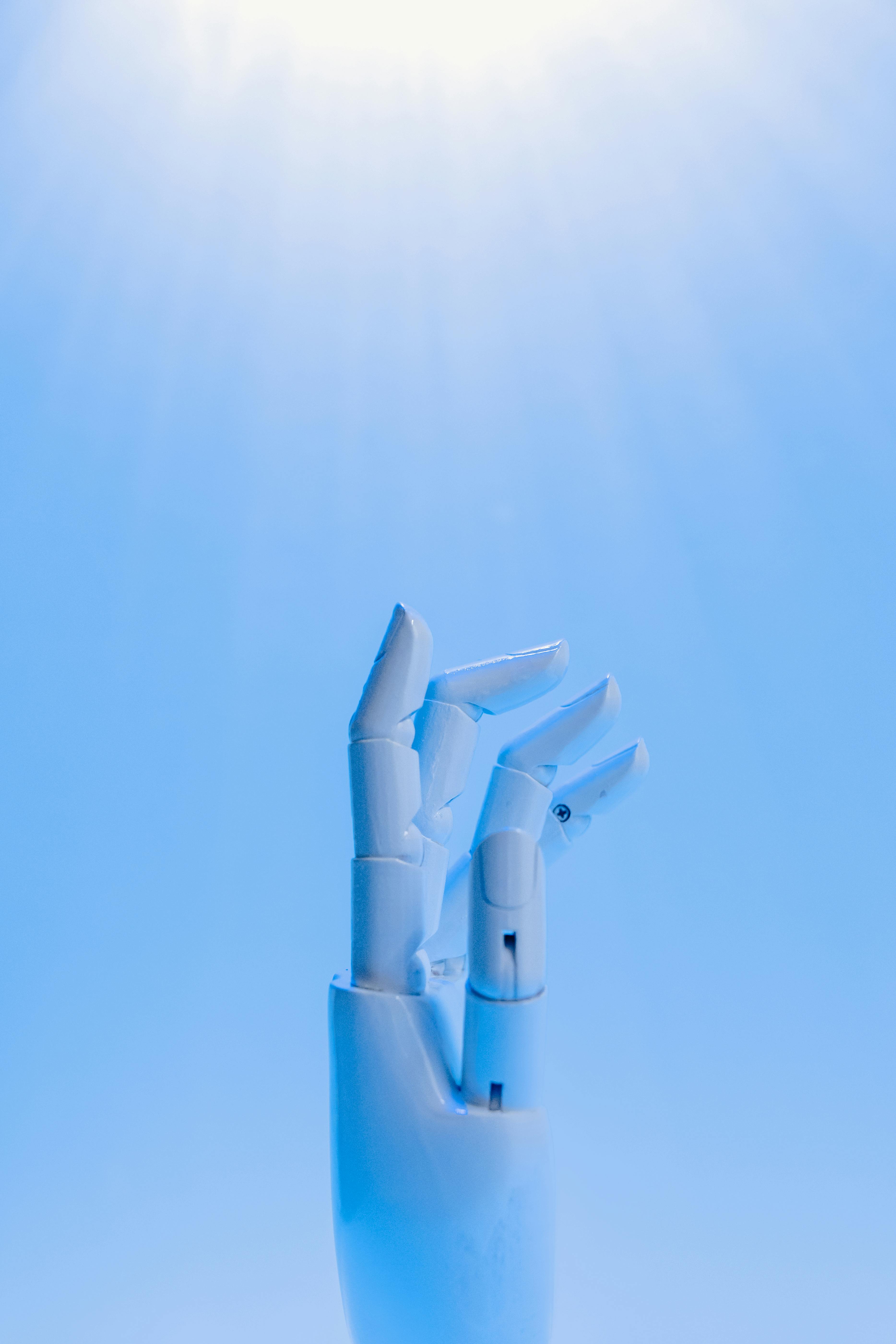 robot hand reaching towards the sky