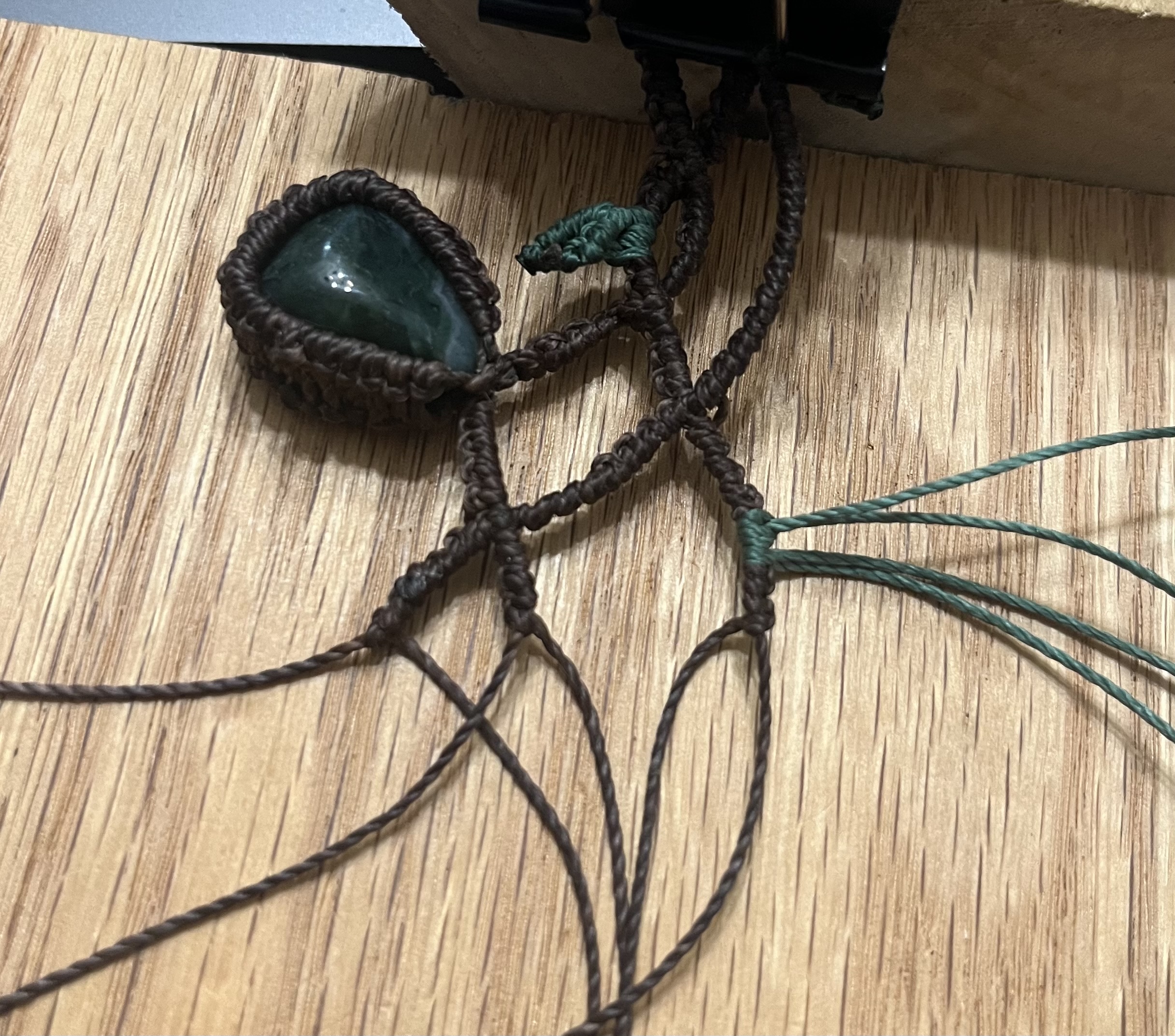 Artisan crafting handmade jewelry at Maple & Spruce studio