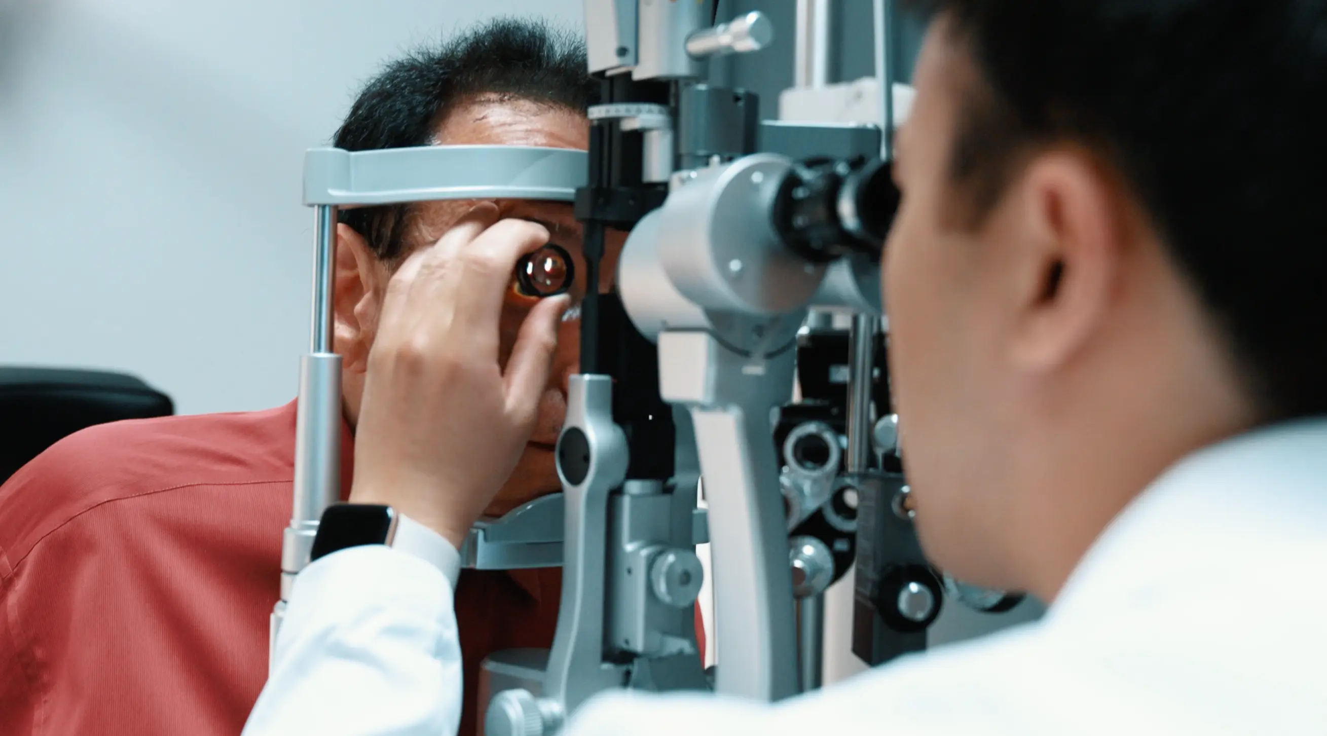 Slit lamp examination at Stratus Eye in Suwanee, GA — Dr. Tran performing post-operative cataract surgery follow-up
