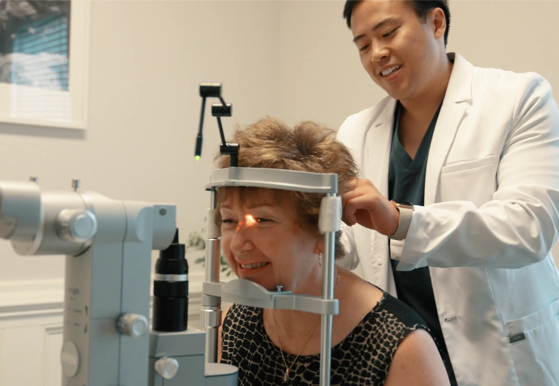 Dr. Jeffrey Tran examining a cataract patient at Stratus Eye in Suwanee, GA