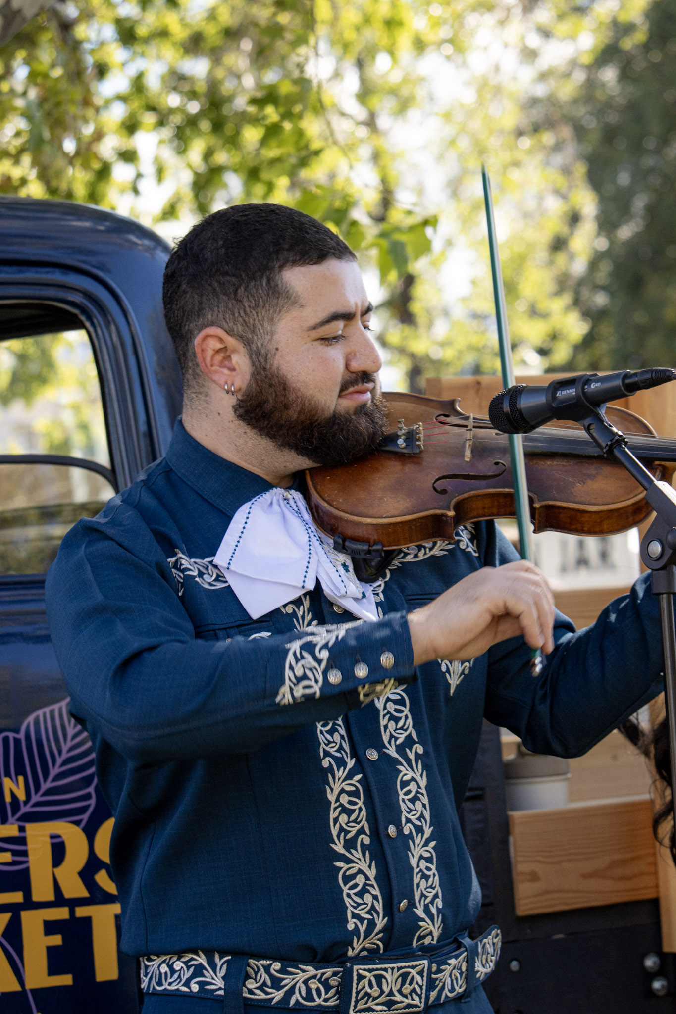 Samuel Castillo violinist of Karlysue y Los Charros performing at a Utah mariachi event