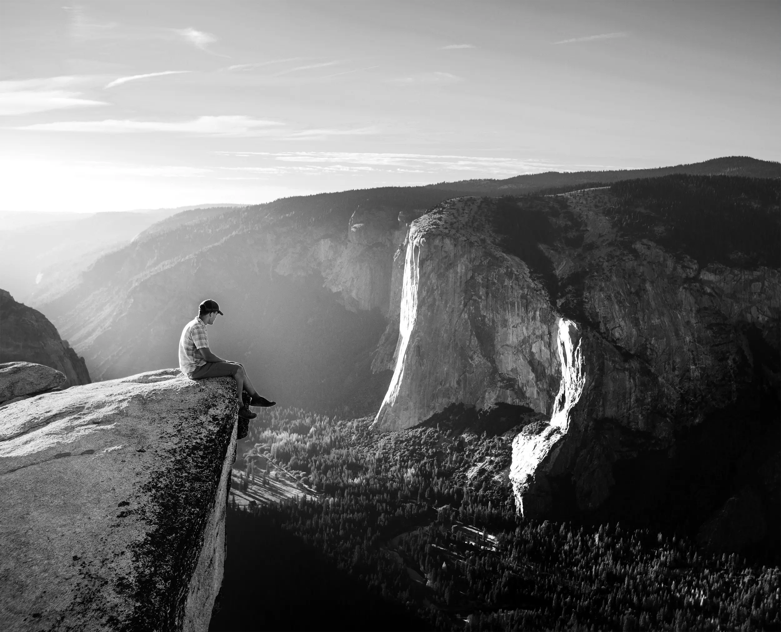 Man on ledge of Glacier Point, Yosemite, CA