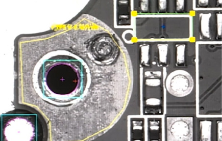 Industrial laser cutting metal sheet with bright sparks flying.